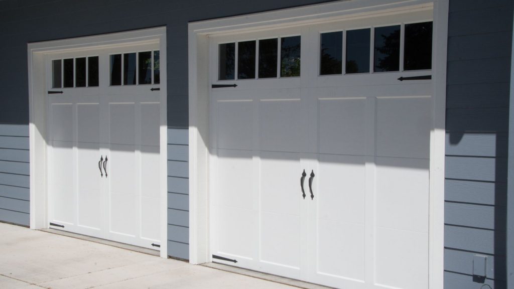 A set of white fiberglass garage doors 